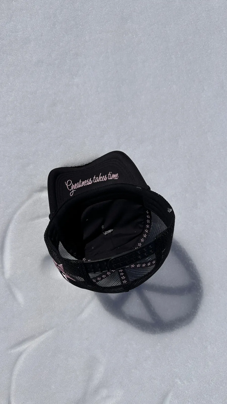 GALNEZ Greatness Takes Time black cap resting on snow